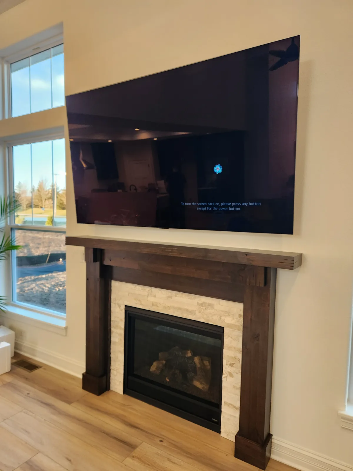 Wall-mounted TV in a finished living room