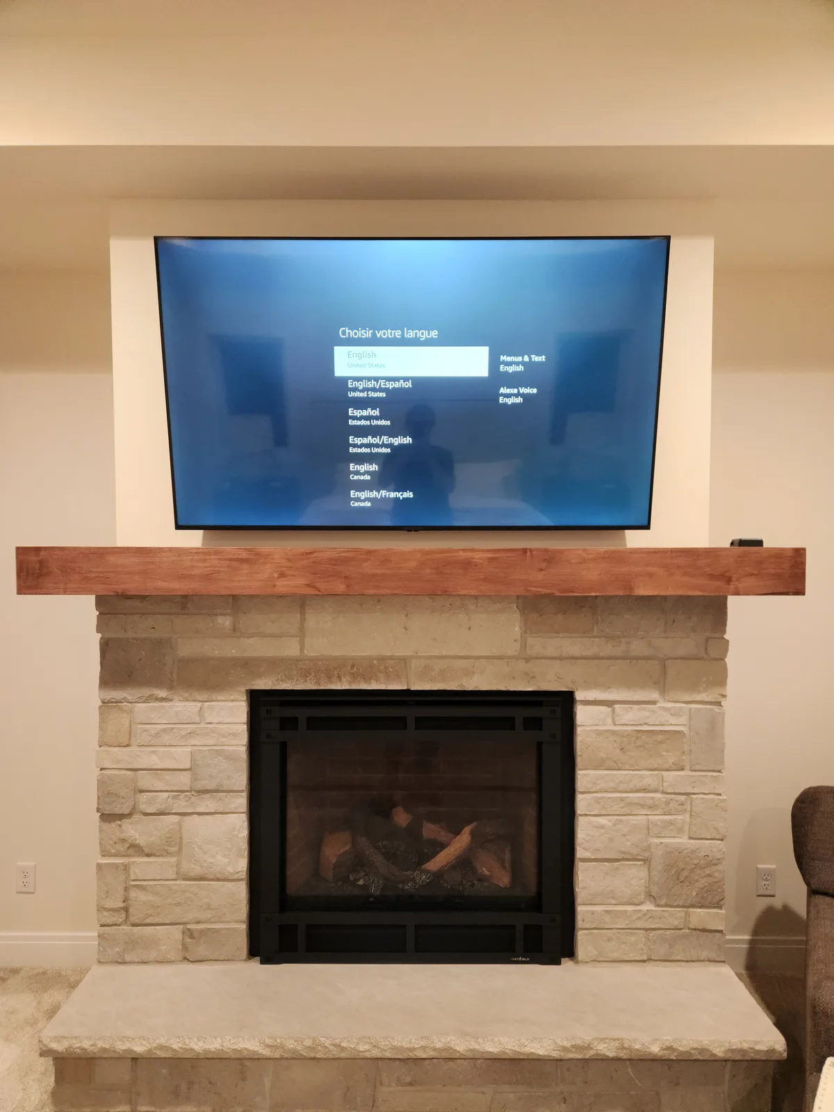 TV mounted on a stone accent wall
